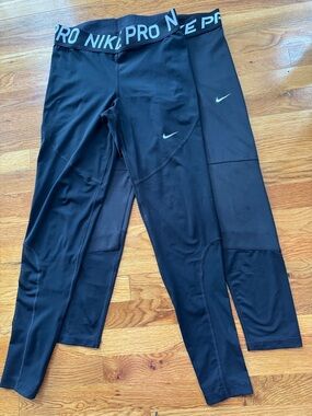Nike woman’s Black Pro Compression Leggings with White Swoosh